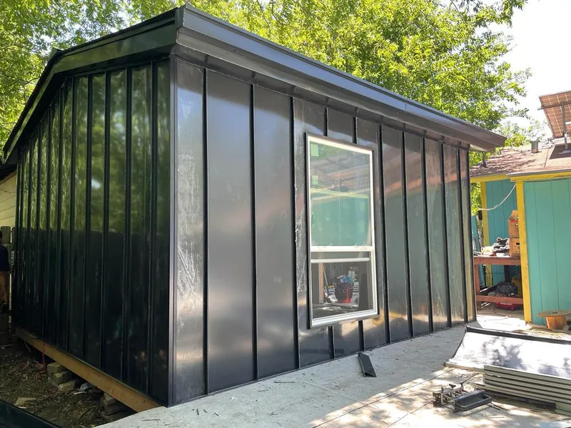 Black standing seam metal wall panels for Metal Roof Installation in Muskegon