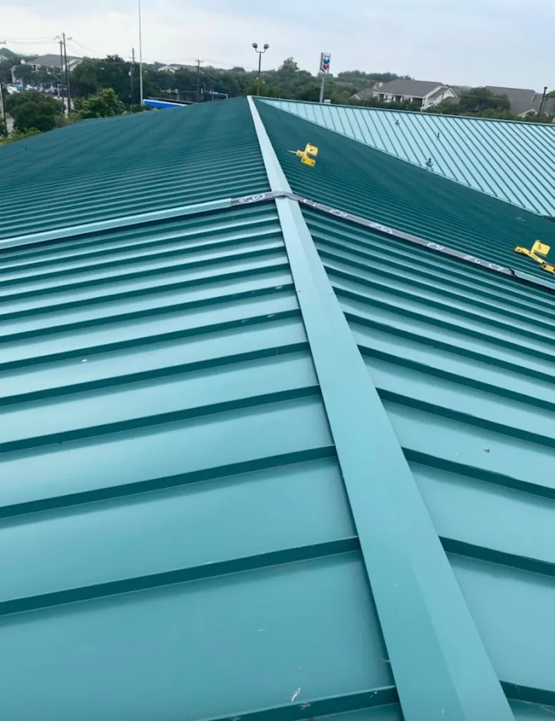 Green commercial metal roof ridge and valley for Metal Roof Repair in Muskegon